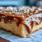 Luscious gold drip frames this elegant graduation sheet cake, ready for toasts.