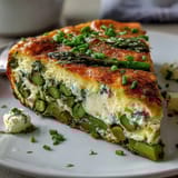 Bright and colorful Spring Frittata with Asparagus, Peas and Goat Cheese, perfect for a light vegetarian meal.
