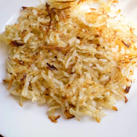 Perfectly browned hash browns with a delicious, crispy texture, ideal with bacon or sausage.